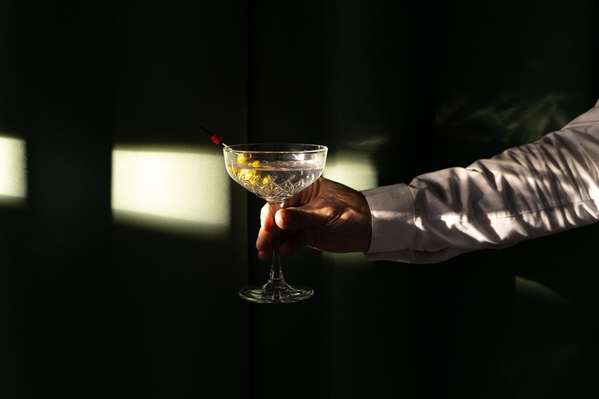 http://www.crossipdrinks.com/cdn/shop/articles/bartender_holding_a_martini_1200x1200.jpg?v=1653393014